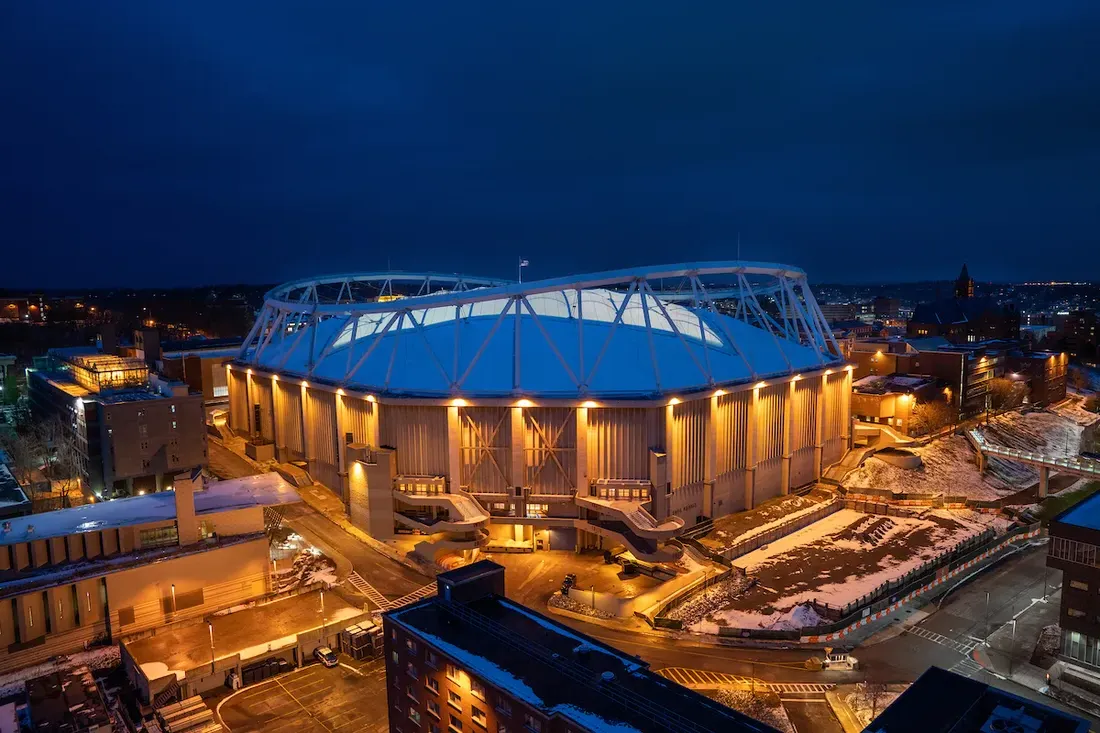 The exterior of the JMA Wireless Dome at night.